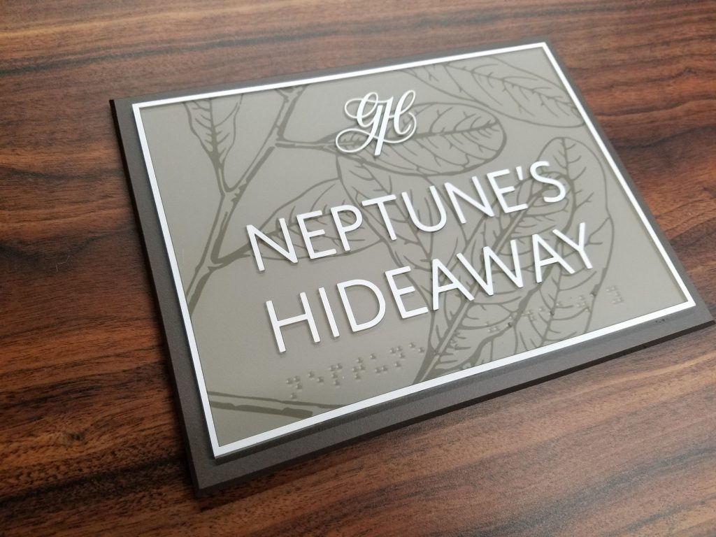 Neptune's Hideaway ada compliant sign